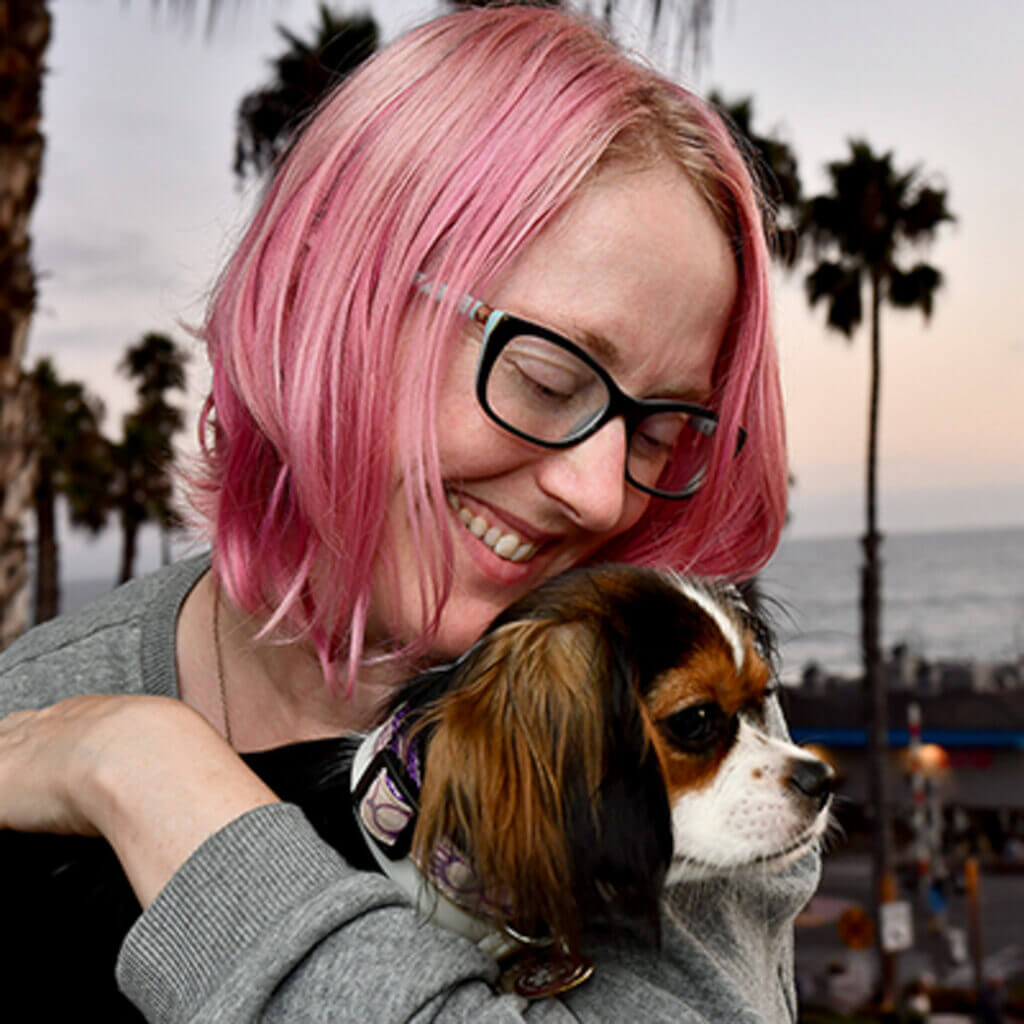 Shay, trauma therapist in San Diego, CA with a cavalier King Charles Spaniel, Luna.