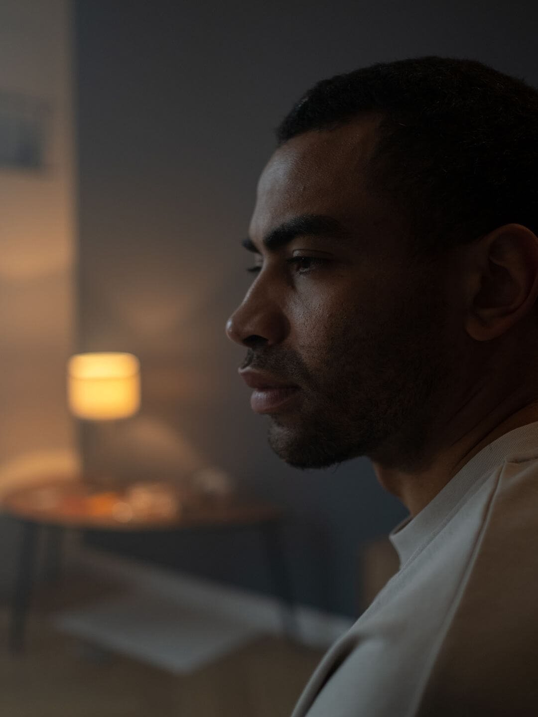 Man reflecting at home β attachment trauma therapy in San Diego